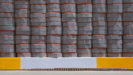 Stack of many octagonal gray pavement blocks on footpath for paving sidewalk in public areaの写真素材