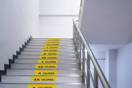 Stickers of Calories burned on staircase inside of office building, stairway for healthy concept