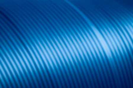 Abstract blurred background of blue spiral pattern with gradient lightingの写真素材