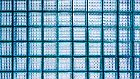 Square pattern of glass block wall background, view from inside room