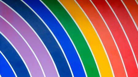 Abstract background of colorful rainbow curve lines pattern on wall decorationの写真素材
