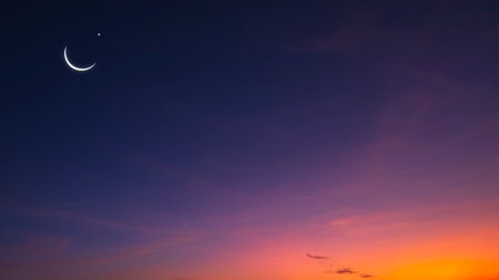 Crescent moon and Star on Dusk sky with beautiful Twilight, Evening sky background with free space for editing arabic text, Ramadan, Eid al-Adha, Eid al-fitr, Mubarakの写真素材