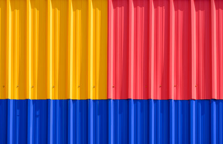 Background and Texture of Colorful red, yellow and blue Corrugated Steel fence Wall decoration, front view with copy spaceの写真素材