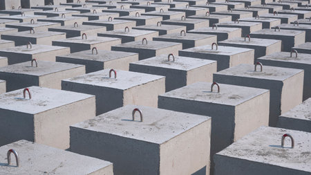 Many Concrete Anchors for posting Undersea Mooring Buoys in industrial yard area