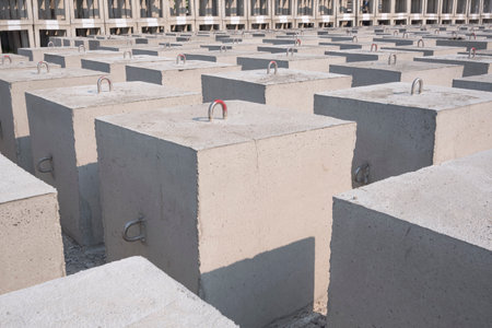 Many Underwater Concrete Anchors mooring buoys and Artificial Reef Blocks in manufacturing industrial yard areaの写真素材