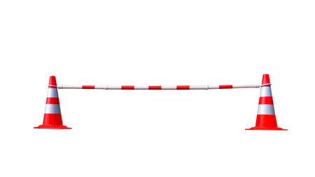 Two red and white traffic cones with adjustable barrier bar on isolated white backgroundの写真素材