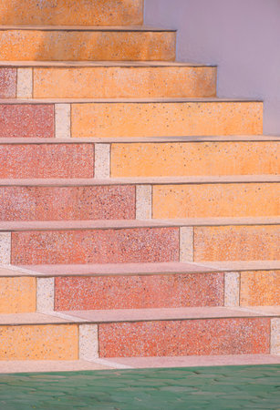 The old colorful Terrazzo stone Steps of vintage Staircase with green paving stone block floor in vertical frameの写真素材