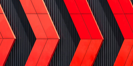 Red aluminum composite tile in Arrow Pattern on black Corrugated Steel Wall Background, exterior...