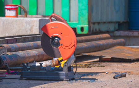 Electric fiber cutting machine on the floor in outdoor workshop area
