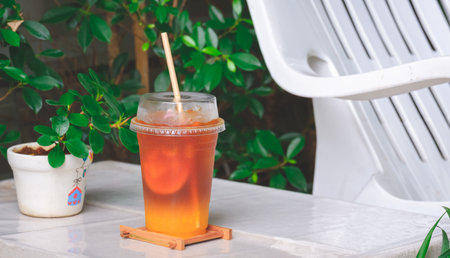 Bumble coffee with iced orange juice and Americano coffee in transparent plastic glass on white desk...