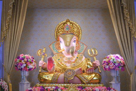 Chiang Mai, Thailand - June 14, 2023 : Beautiful Lord Ganesha Dagadusheth statue enshrined in a Hindu templeのeditorial素材