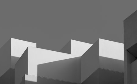 Modern house Building with Sunlight and Shadow on concrete wall surface in Perspective low angle view, Geometric Architecture background in Minimal with Black and White styleの写真素材