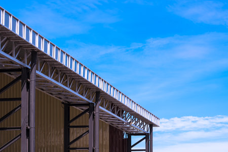 Aluminium rain gutter on the edge of roof with steel rainwater pipes of outdoor multi-purpose...