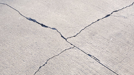 Broken crack lines texture on the old damaged concrete floor backgroundの写真素材