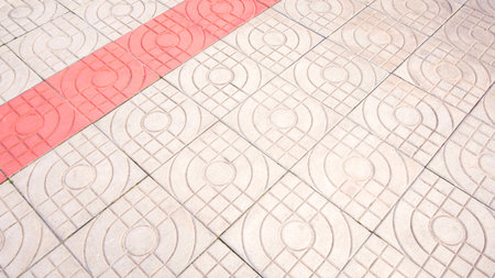 Concrete pavement floor background with red and white modern geometric abstract pattern, high angle view with copy spaceの写真素材