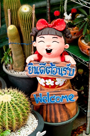 Girl doll  Cactus in the red and tex Welcomeの写真素材