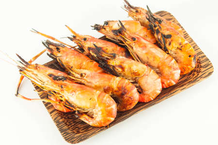 grilled prawns on wood dish white isolateの写真素材
