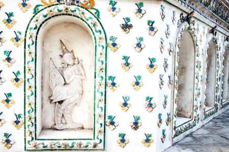 antique wall with Kinnaree  Mythical female bird with a human head の写真素材