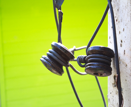Closeup electrical insulator on the electricity postの写真素材