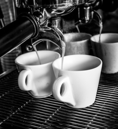 coffee machine makes two coffeeの写真素材