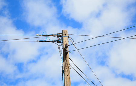 electricity post with blue sky and cloud