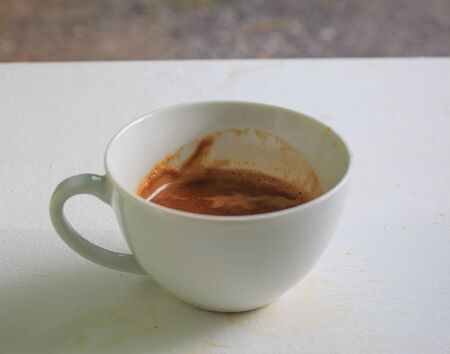 The coffee maker one shot on white cupの写真素材