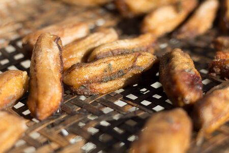 The fungus on dried bananas in bamboo sieveの写真素材