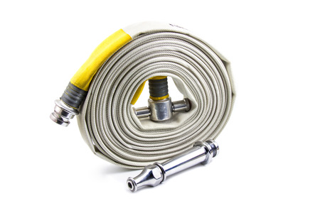 Fire extinguisher and fire hose reel inside the building on isolated a white background.の写真素材