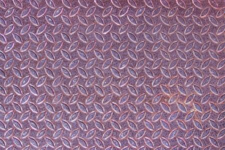 Grunge rusty steel diamond metal plate background.