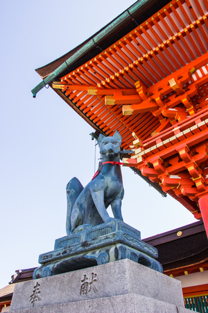 KYOTO, JAPAN - MARCH 12, 2018: Fox statue at the entrance gate of Fushimi Inari shrine, Kyoto.のeditorial素材