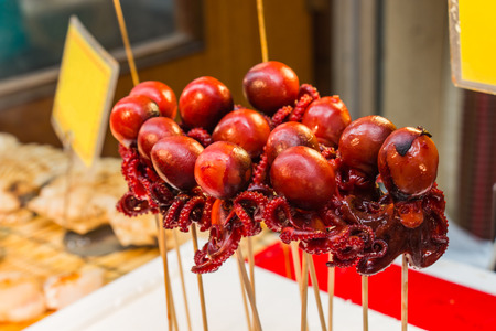 Baby octopus stuffed with a quail egg at market in Kyoto. Japanの写真素材