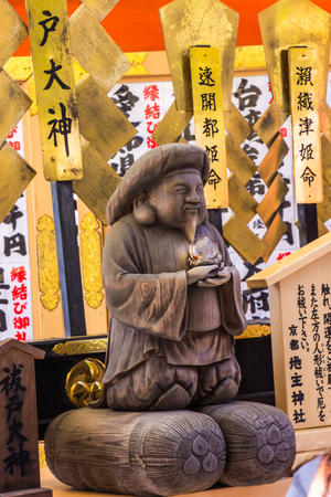 KYOTO, JAPAN - MARCH 12, 2018: Tourist at Kiyomizu-dera temple use your hands to touch God Harada Edo Okami for pray a god who purifies the body and mind in Kyoto, Japan.のeditorial素材