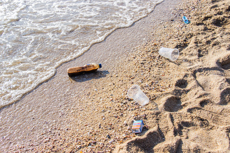 Plastic and other pollution garbage are problem on the beach at caused by much volume tourists popular tourist destination.の写真素材