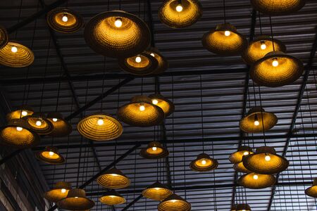 Fabricated lamp from a hat made of local materials bamboo inside restaurant at Amphawa floating market is the tourist most popular in Thailand.の写真素材