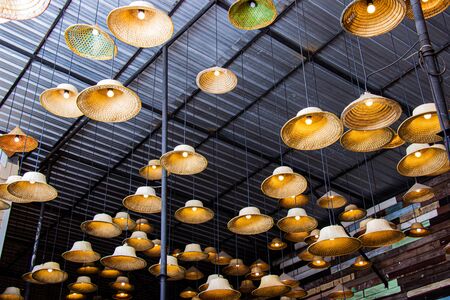 Fabricated lamp from a hat made of local materials bamboo inside restaurant at Amphawa floating market is the tourist most popular in Thailand.の写真素材