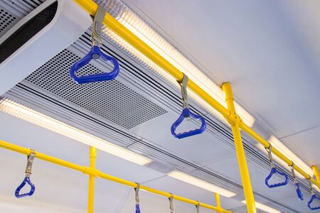 The handle on ceiling of sky train and underground railway system for the safety of traveling.