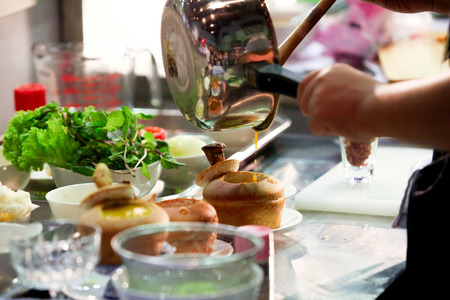 Chef preparing food, meal, in the kitchen, chef cooking, Chef decorating dish, closeup, chef at workの写真素材