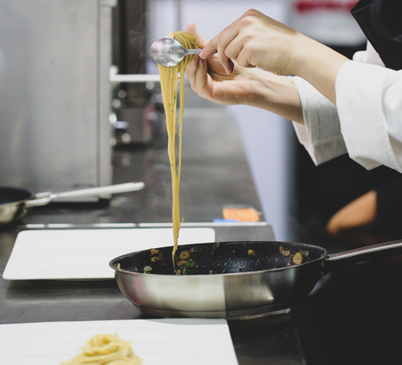 Chef preparing food, meal, in the kitchen, chef cooking, Chef decorating dish, closeup, chef at...