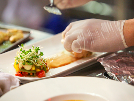 Chef preparing food, meal, in the kitchen, chef cooking, Chef decorating dish, closeup, 
chef at workの写真素材