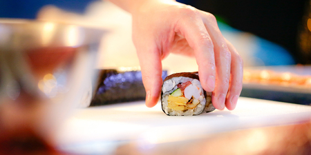 chef hands preparing japanese food, chef making sushi, Preparing Sushi rollの写真素材