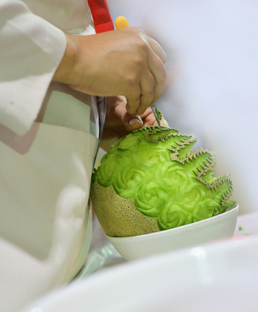 Thai fruit carving with hand, Vegetable and Fruit Carvingの写真素材