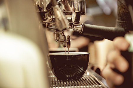 espresso shot from coffee machine in coffee shop, Coffee maker in coffee shopの写真素材