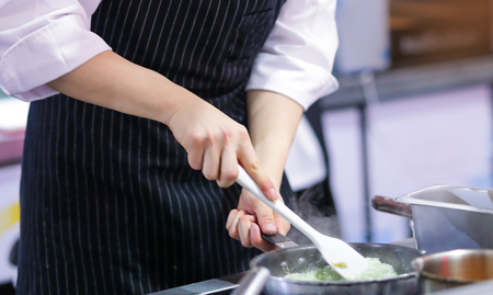 Chef cooking food in the kitchen, Chef preparing foodの写真素材