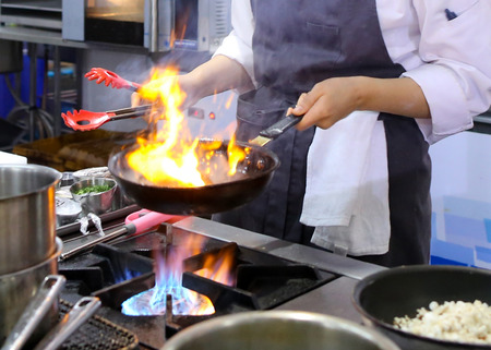 Chef cooking food in the kitchen, Chef preparing foodの写真素材
