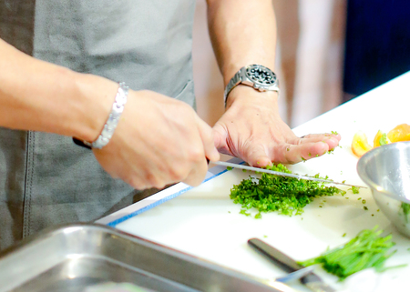 chopping green onion, Chef cutting fresh vegetables for cookingの写真素材
