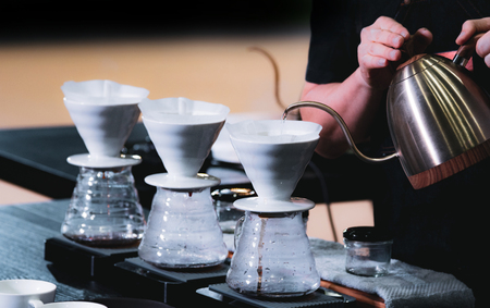 Barista is making coffee, coffee preparing with dripperの写真素材