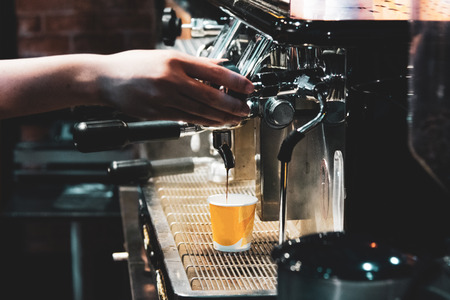 espresso shot from coffee machine in coffee shop,Coffee maker in coffee shopの写真素材