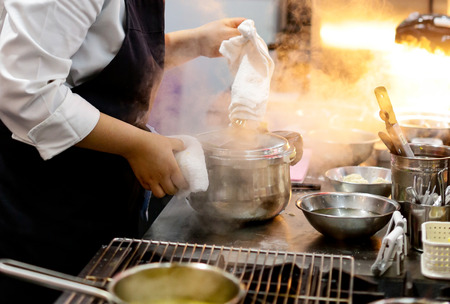 Chef preparing food, meal, in the kitchen, chef cooking, Chef decorating dish, closeupの写真素材