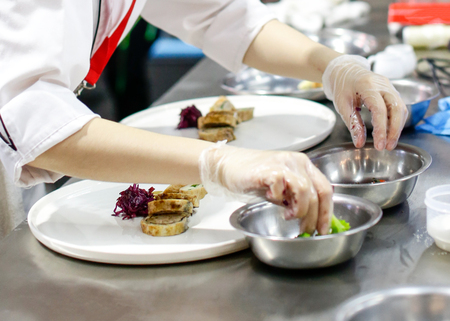 Chef cooking food in the kitchen, Chef preparing foodの写真素材