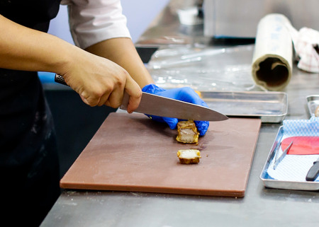 Chef preparing food, meal, in the kitchen, chef cooking, Chef decorating dish, closeupの写真素材